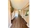 Inviting foyer with hardwood floors, leading to an open floor plan and staircase at 8830 Kipling Dr, Indianapolis, IN 46239