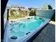 Inviting hot tub with clear water, open lid, and outdoor setting offering a relaxing space at 8830 Kipling Dr, Indianapolis, IN 46239