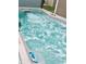 Close-up of a hot tub with bubbling water and several jets, showcasing the spa's features at 8830 Kipling Dr, Indianapolis, IN 46239