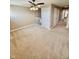 Bright living room with ceiling fan, carpet, and a cozy atmosphere for relaxing and entertaining at 8830 Kipling Dr, Indianapolis, IN 46239