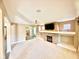 Open-concept living room featuring a stone fireplace and ample natural light at 8830 Kipling Dr, Indianapolis, IN 46239
