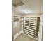 Bright walk-in closet features built-in shelving and clothing racks at 8830 Kipling Dr, Indianapolis, IN 46239