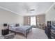 Spacious bedroom with a ceiling fan, neutral paint, and a large window at 9162 Cinnebar Dr, Indianapolis, IN 46268