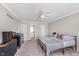Large bedroom with an ensuite bathroom featuring neutral paint and plush carpet at 9162 Cinnebar Dr, Indianapolis, IN 46268