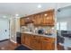 Functional kitchen featuring wood cabinets, modern appliances, and a tiled backsplash at 9162 Cinnebar Dr, Indianapolis, IN 46268