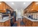 Well-equipped kitchen with wood cabinets, modern appliances, and stylish backsplash at 9162 Cinnebar Dr, Indianapolis, IN 46268