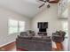 Spacious living room with high ceilings, hardwood floors, large windows, and ample natural light at 9162 Cinnebar Dr, Indianapolis, IN 46268