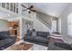 Cozy living room featuring hardwood floors, a ceiling fan, and a staircase to the second level at 9162 Cinnebar Dr, Indianapolis, IN 46268