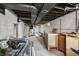 Unfinished basement providing ample storage and utility space, awaiting personalized upgrades at 940 N Chester Ave, Indianapolis, IN 46201