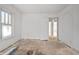 A light-filled bedroom boasts hardwood floors and a closet, ready to be transformed into a haven at 940 N Chester Ave, Indianapolis, IN 46201