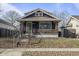 Charming single-Gathering home with brick and blue siding and covered porch at 940 N Chester Ave, Indianapolis, IN 46201