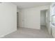 Spacious carpeted bedroom with two doors and a window offering abundant natural light at 9734 Behner Dr, Fishers, IN 46250
