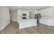 Modern kitchen featuring a center island, stainless steel appliances, white cabinets, and modern finishes at 9734 Behner Dr, Fishers, IN 46250