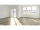 Bright living room with natural light, sliding doors, and stylish flooring, perfect for entertaining at 9734 Behner Dr, Fishers, IN 46250
