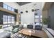 Bright lobby space with modern furnishings, a pool table, and an open design concept at 9734 Behner Dr, Fishers, IN 46250