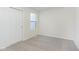 Cozy bedroom with neutral carpet, closet, and a bright window at 9735 Behner Dr, Fishers, IN 46038