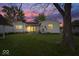 Backyard featuring a well-maintained lawn and a patio area with glass doors leading indoors at 1002 Prairie Depot, Indianapolis, IN 46241