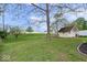 Lush backyard with a shed, expansive green lawn, and plenty of room for outdoor activities at 1002 Prairie Depot, Indianapolis, IN 46241