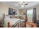 Cozy bedroom with a ceiling fan, natural light, and a comfortable couch to relax at 1002 Prairie Depot, Indianapolis, IN 46241