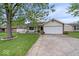 Beautiful home with a well-manicured lawn, concrete driveway, and a cozy front porch at 1002 Prairie Depot, Indianapolis, IN 46241