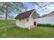 Charming backyard shed offering extra storage, nestled in a green, well-maintained lawn at 1002 Prairie Depot, Indianapolis, IN 46241