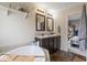Bathroom featuring double sink vanity, tile backsplash and soaking tub at 1040 Iowa St, Columbus, IN 47201