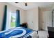 Bedroom featuring carpet floors, light walls and a window overlooking the yard at 1040 Iowa St, Columbus, IN 47201