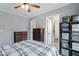 Bedroom featuring carpet flooring, ceiling fan and plenty of closet storage at 1040 Iowa St, Columbus, IN 47201