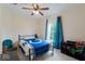 Bedroom with carpet flooring, ceiling fan and natural light from the window at 1040 Iowa St, Columbus, IN 47201