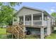 Charming home featuring a large covered front porch with a spacious layout and inviting curb appeal at 1040 Iowa St, Columbus, IN 47201