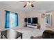 The large living room is open and bright, and features neutral carpet and ample natural light at 1040 Iowa St, Columbus, IN 47201