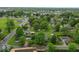 Aerial view of the neighborhood, with mature trees and diverse single-Gathering homes at 1040 Iowa St, Columbus, IN 47201
