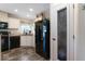 The kitchen area has black appliances and a pantry door with glass at 1040 Iowa St, Columbus, IN 47201