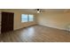 Bright living room featuring new flooring, fresh paint, and double windows offering natural light at 107 N Grant St, Brownsburg, IN 46112