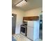 Efficient kitchen equipped with basic appliances and wooden cabinets, maximizing space and functionality at 11 W Osage St, Greenfield, IN 46140