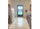 Bright kitchen featuring blue curtains and tile floors, creating a clean and practical space at 11 W Osage St, Greenfield, IN 46140
