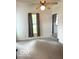 Living room featuring a ceiling fan, large window, and neutral-colored walls at 11 W Osage St, Greenfield, IN 46140