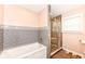 Elegant bathroom featuring a soaking tub, tiled shower, and modern vanity with stylish accents at 1101 Oakwood Trl, Indianapolis, IN 46260