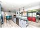 Spacious kitchen with breakfast bar connects seamlessly to the dining and living areas, great for entertaining at 1101 Oakwood Trl, Indianapolis, IN 46260