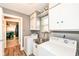 Functional laundry room equipped with a sink, washer, dryer, and built-in cabinets for storage at 1101 Oakwood Trl, Indianapolis, IN 46260