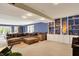 Spacious basement with built-in shelving and recessed lighting offers flexible living at 12669 Brookshire Pkwy, Carmel, IN 46033