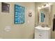 Quaint bathroom with vanity, decorative mirror, and playful wall art adding character to the space at 12669 Brookshire Pkwy, Carmel, IN 46033
