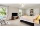 Bright bedroom features lots of natural light, neutral decor, and a ceiling fan at 12669 Brookshire Pkwy, Carmel, IN 46033