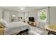 This bedroom features natural light, neutral decor, and a ceiling fan at 12669 Brookshire Pkwy, Carmel, IN 46033