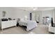 This bedroom features neutral decor, a ceiling fan, and lots of natural light at 12669 Brookshire Pkwy, Carmel, IN 46033