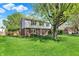 Well-maintained two-story home with lush green lawn and mature landscaping at 12669 Brookshire Pkwy, Carmel, IN 46033