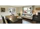 Comfortable home office with desk, couch, and ample natural light, perfect for a productive workspace at 12669 Brookshire Pkwy, Carmel, IN 46033