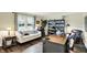 Inviting home office with a large desk, plush seating, and extensive shelving, ideal for focus and productivity at 12669 Brookshire Pkwy, Carmel, IN 46033