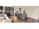 Well-lit home office offering a spacious desk, cozy seating, and ample storage, perfect for a professional environment at 12669 Brookshire Pkwy, Carmel, IN 46033