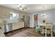 Well-lit kitchen with stainless steel appliances and adjacent dining area, perfect for cooking and casual meals at 12669 Brookshire Pkwy, Carmel, IN 46033